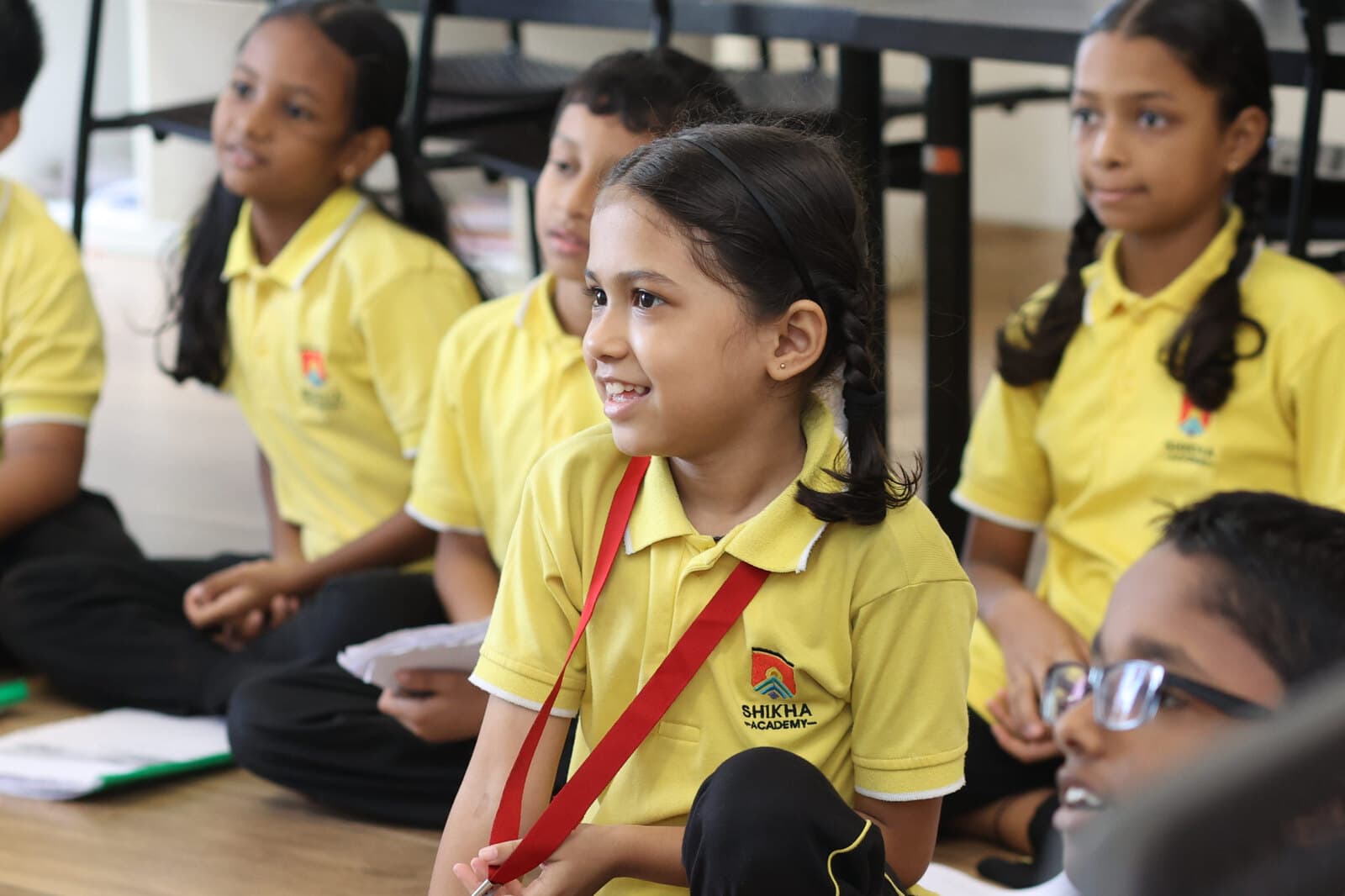 Students taking part in a facilitated classroom discussion